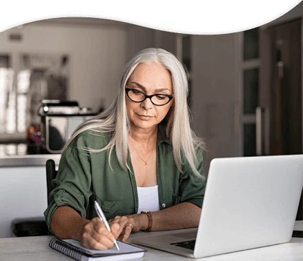 woman filling out forms at desk